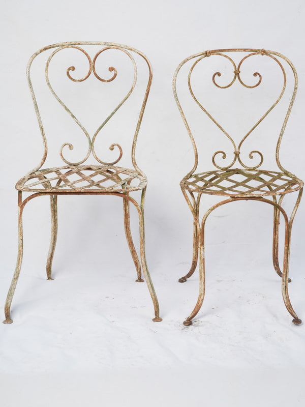 Weathered white heart-back patio chairs