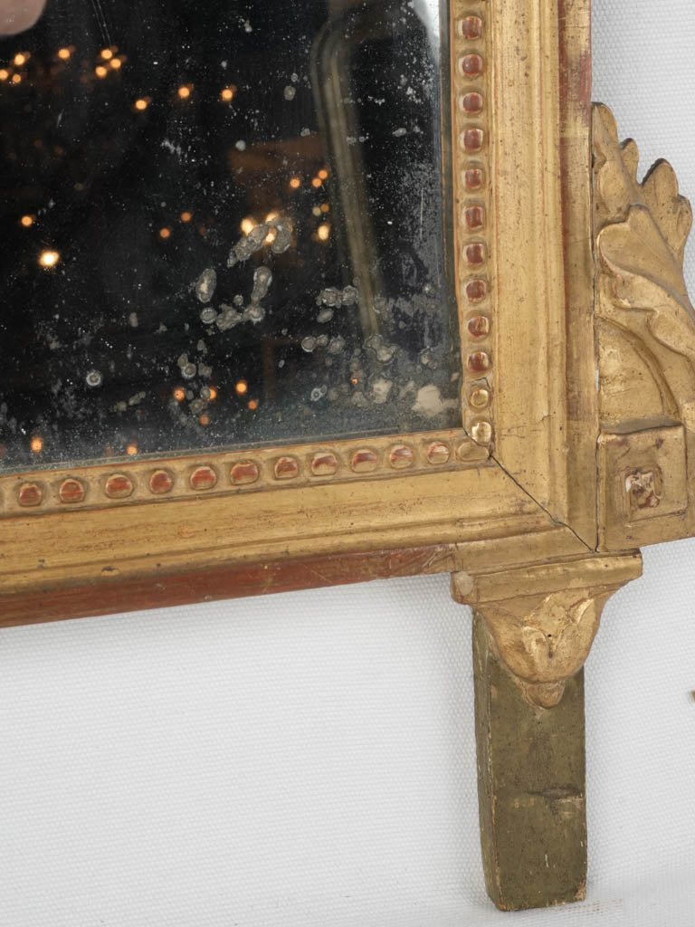 Aged, gilded heart trophy wall mirror