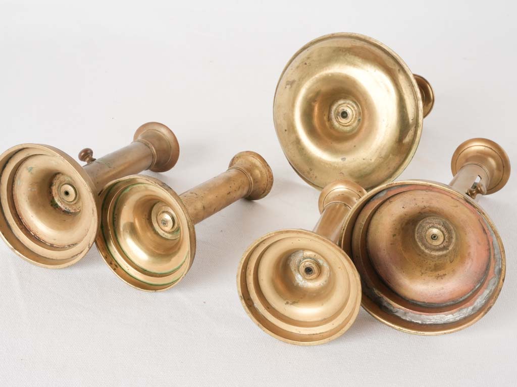 Time-worn brass candlestick assortment