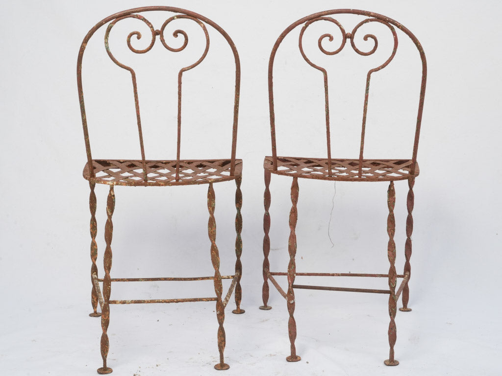 Weathered antique iron garden chairs