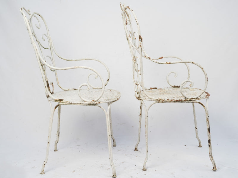 Elegant, weathered white armchairs