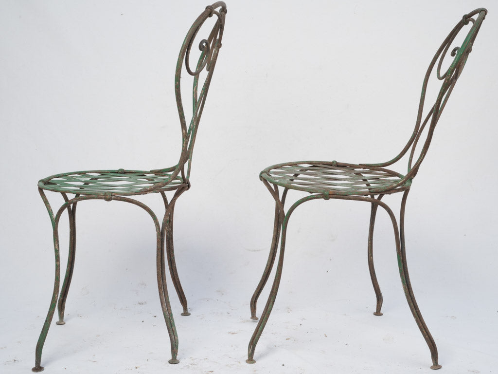 Charming weathered green garden chairs