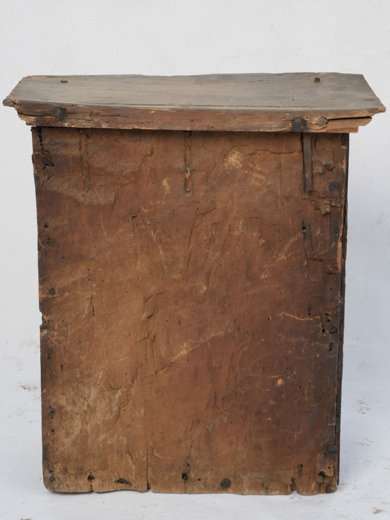 Antique, worn wooden oratory cabinet