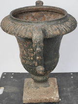 Distinctive, aged, black patina cast iron urn