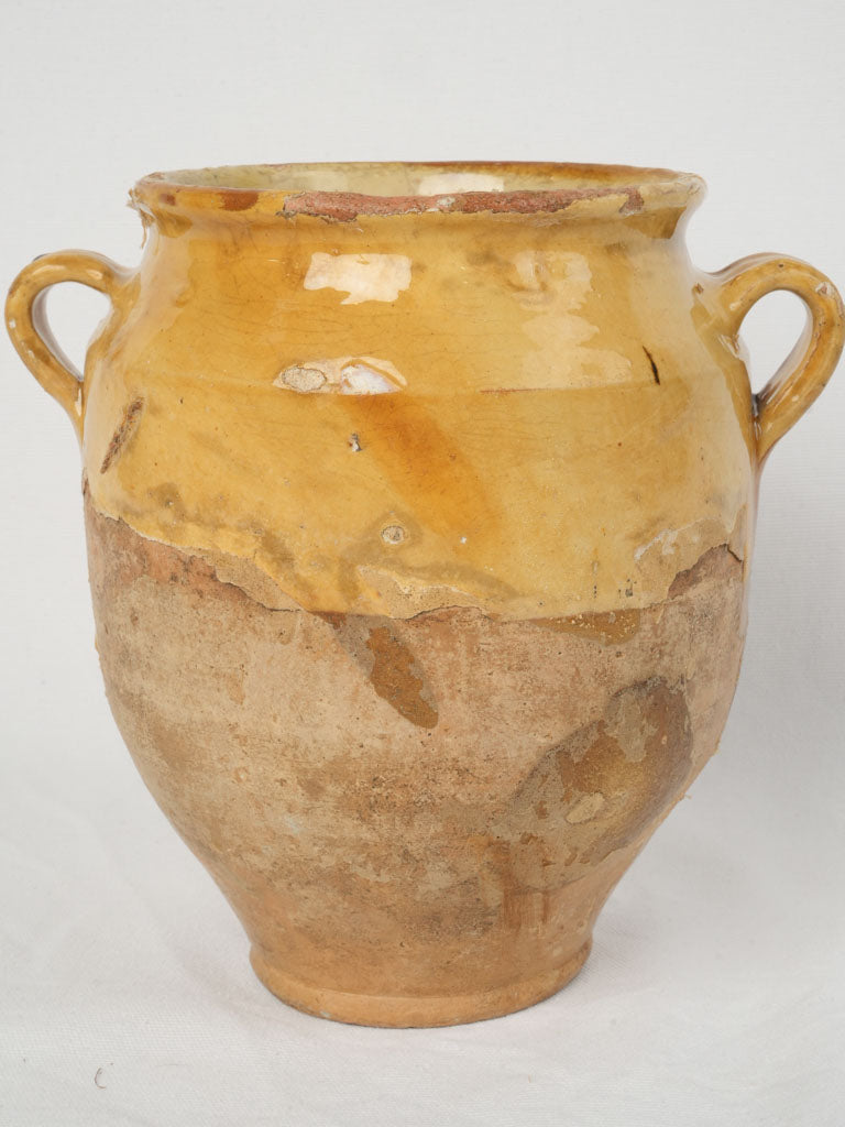 Worn and authentic French confit pot