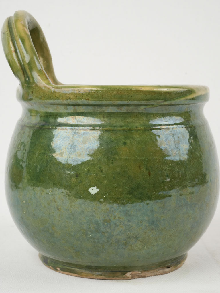 Delightful green antique milking vessel