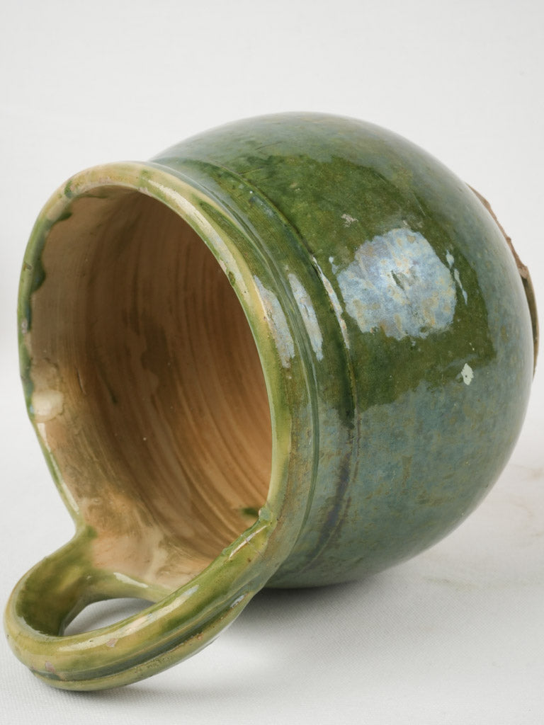 Aged green-glazed milk pourer