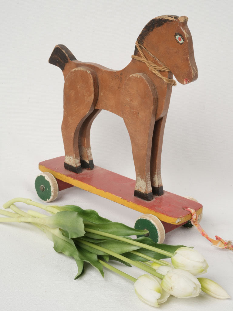 Naïve painted folk-art horse ride