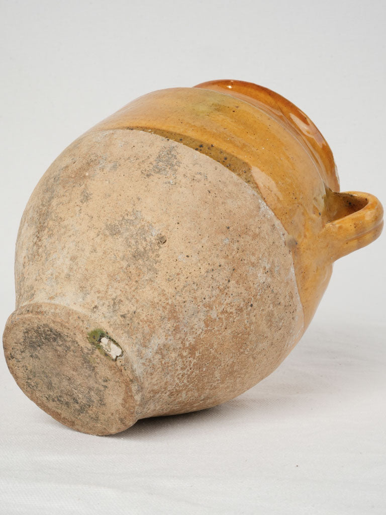 Well-loved antique ocher French confit pot