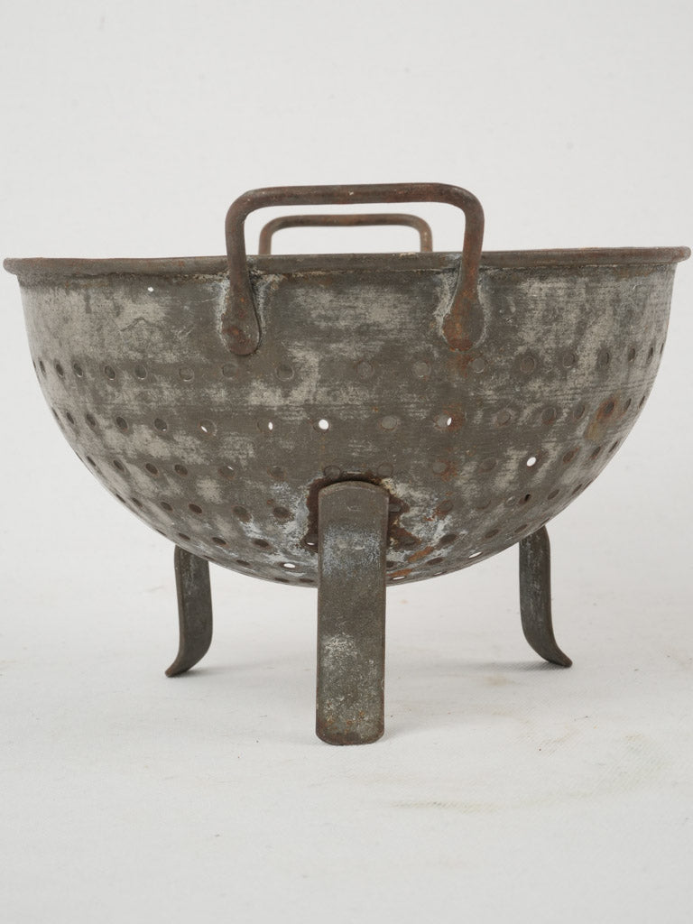 French, rustic antique fruit strainer