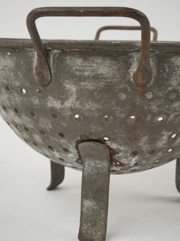 Vintage, weathered kitchen colander