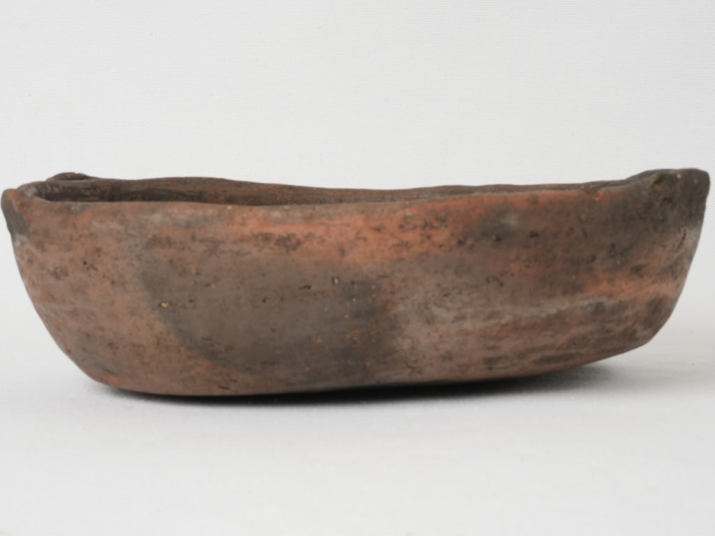 Rustic 19th-century terracotta oval cooking bowl