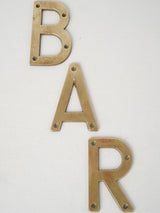 Vintage French brass "BAR" letters