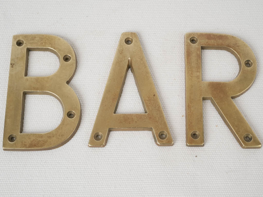 Rustic, historic French brass signage