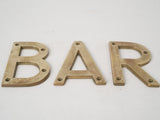 Patina-covered vintage brass letters