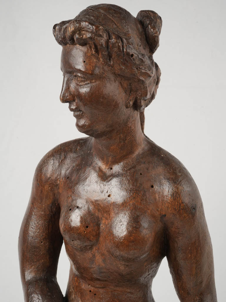 Refined carved wooden figure