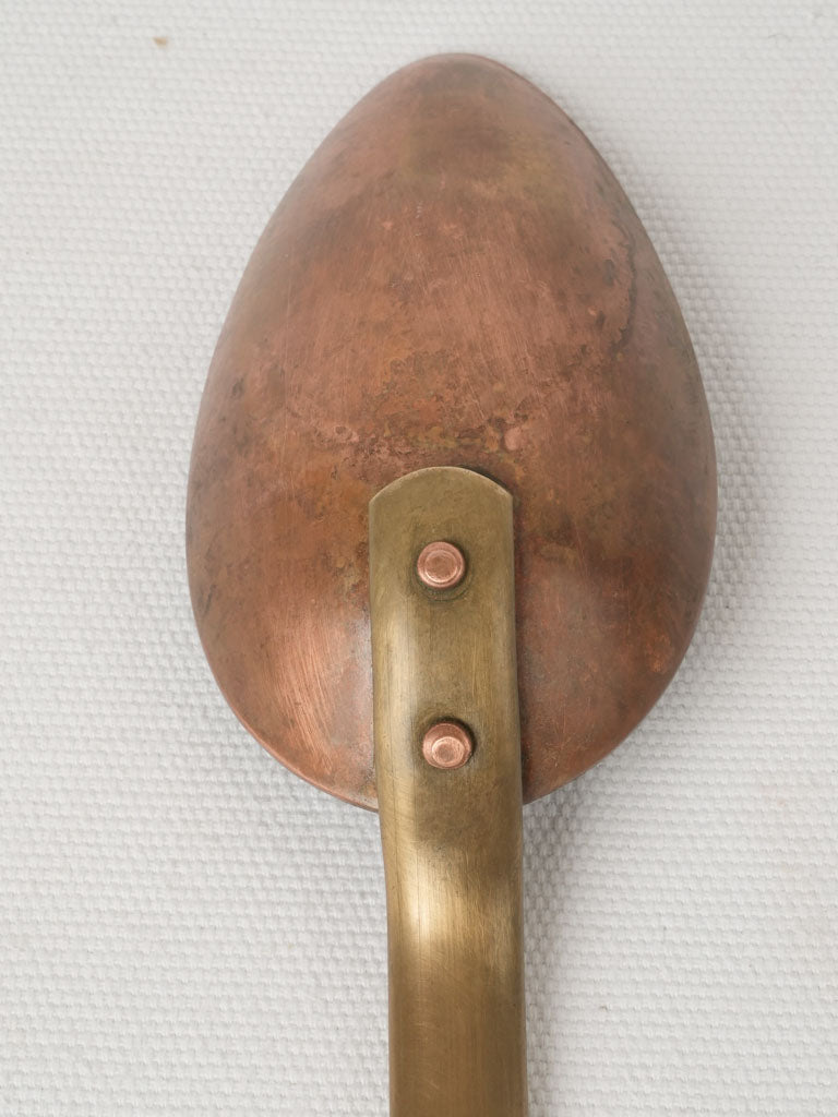 Decorative, practical vintage copper spoon