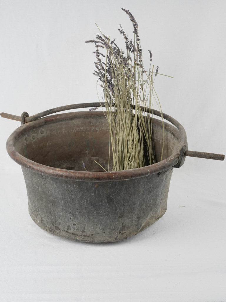 Weathered, rustic copper cookware cauldron