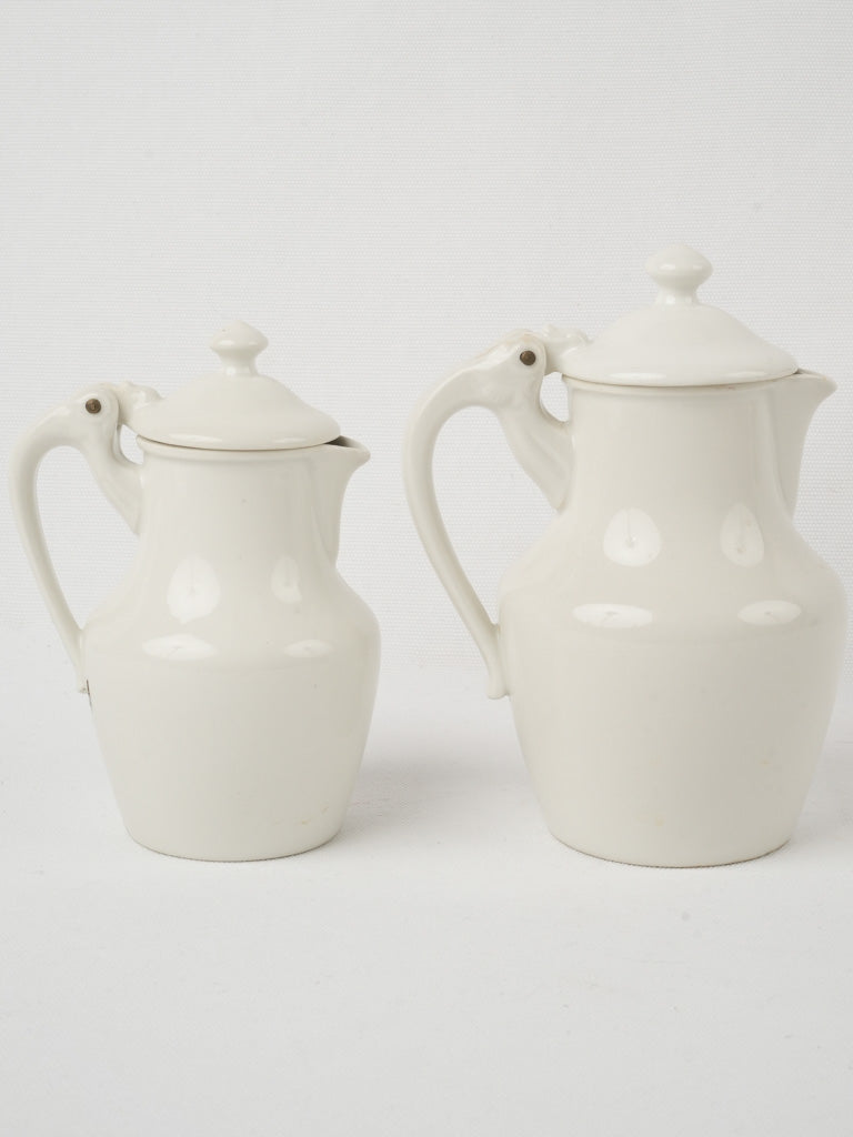 Classic lidded Limoges wine jugs