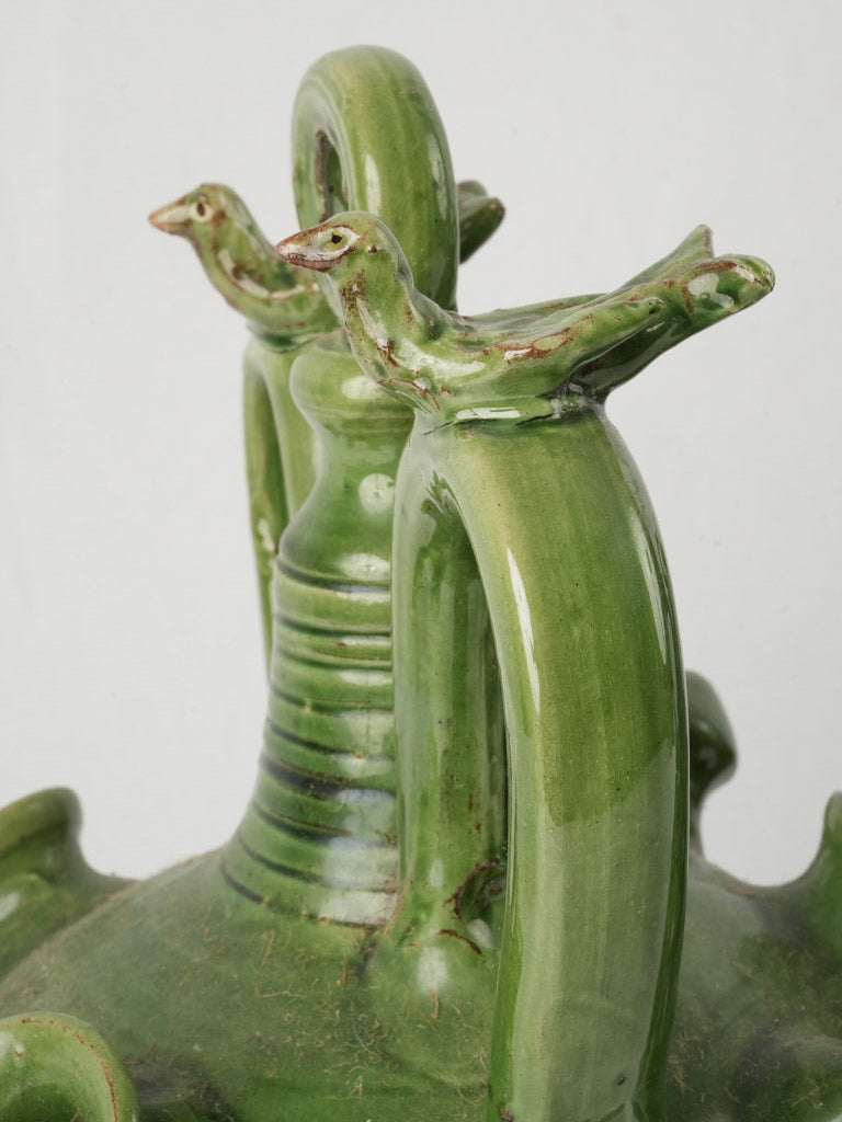 Charming bird-topped green jugs