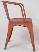 Patina-worn 1950s Tolix chair