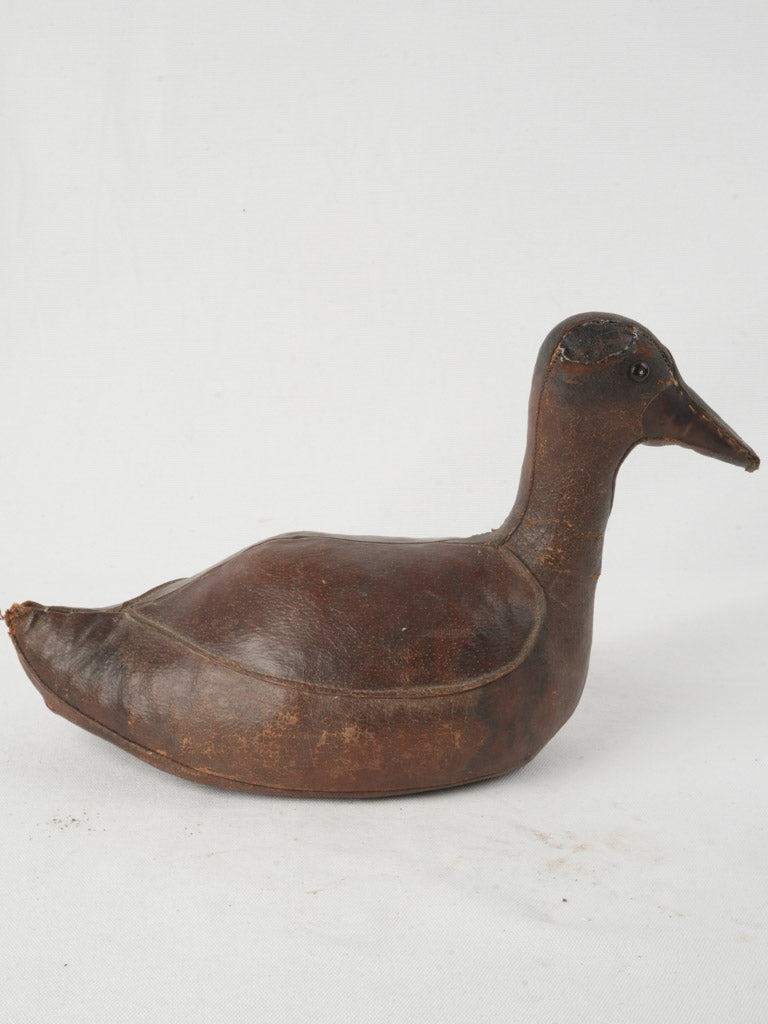 Timeworn charming leather duck sculpture  