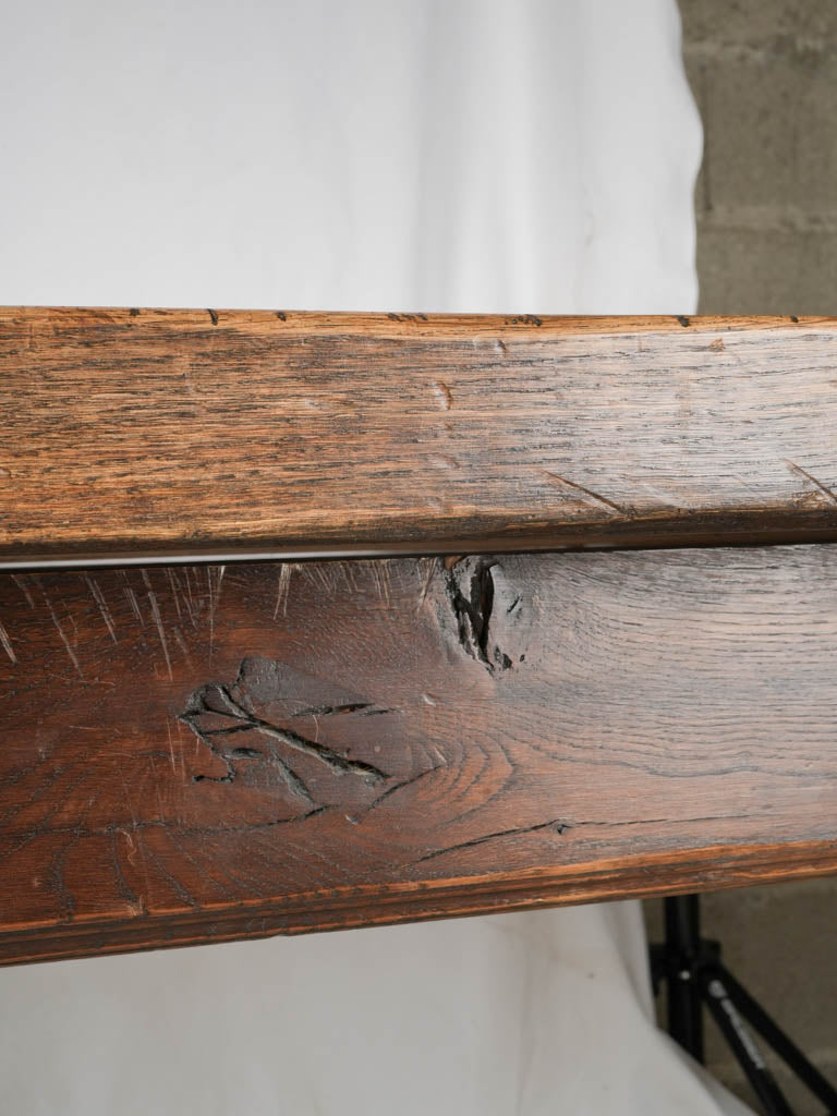 Weighty dark-stained oak dining table