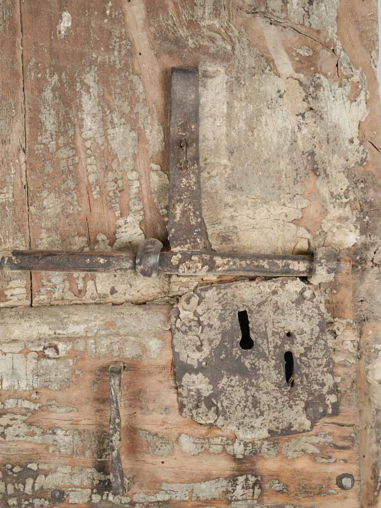 Weathered iron hardware wine door