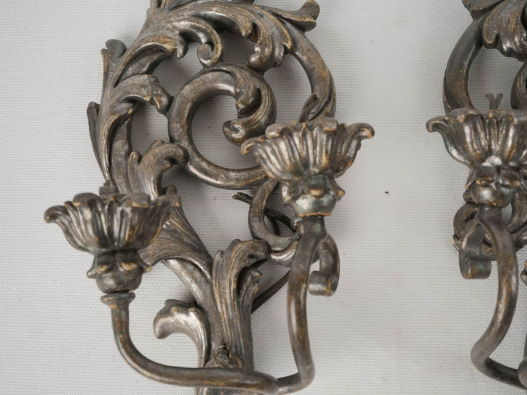 Intricate scrolling acanthus sconces