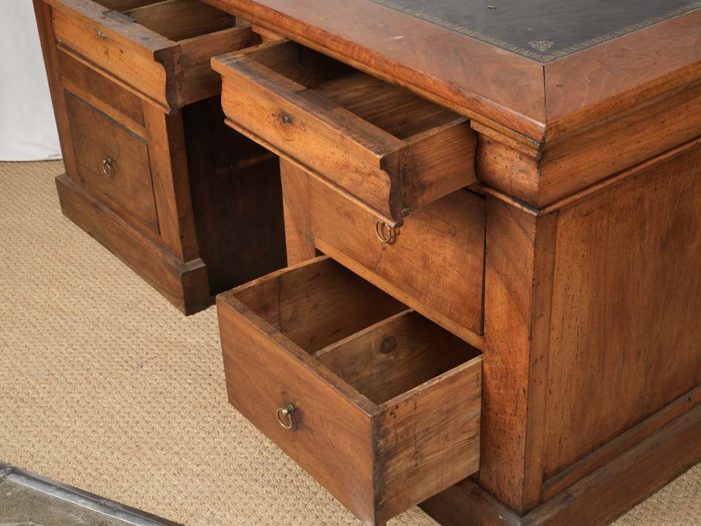 Understated ornate walnut pedestal desk