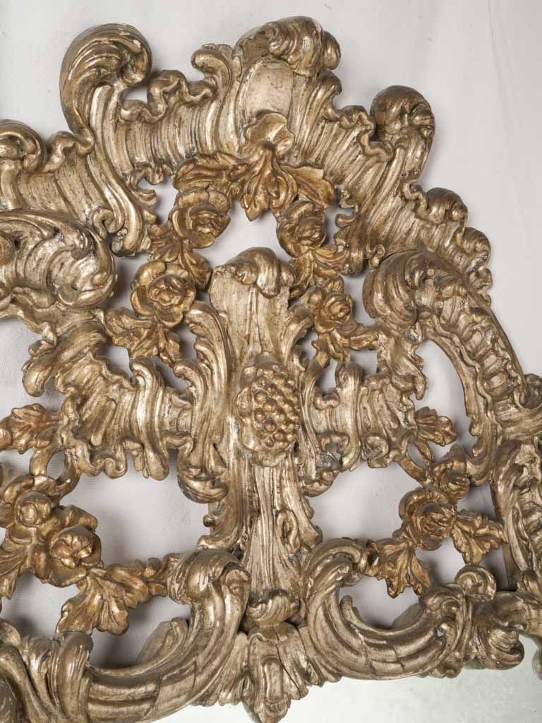 Ornate floral-relief pediment mirror