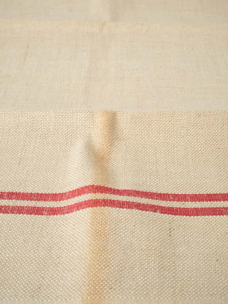 Intricate monogrammed red stripe textiles