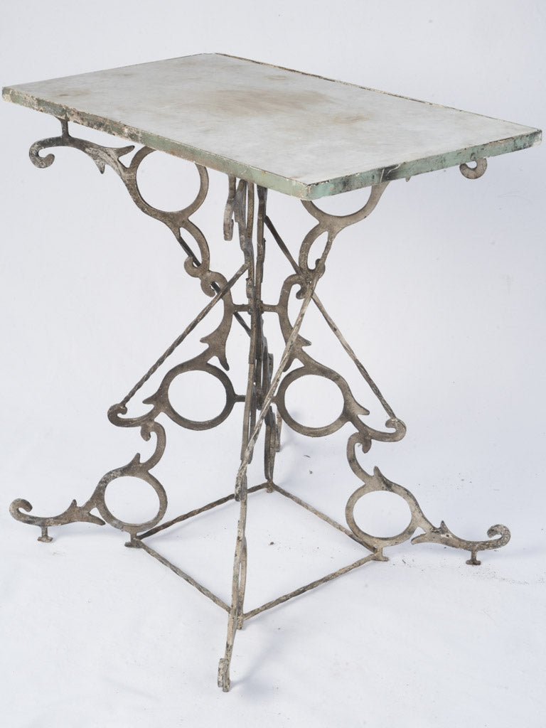 Intricate iron base accent table  