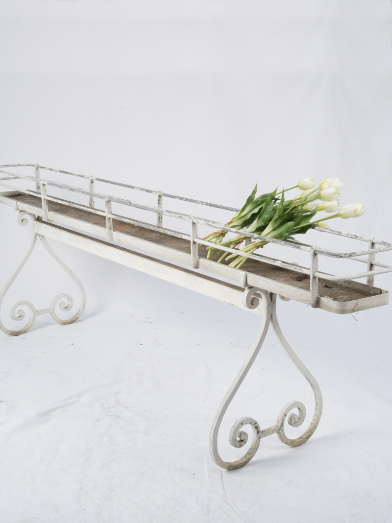 Weathered scrollwork legs iron planter