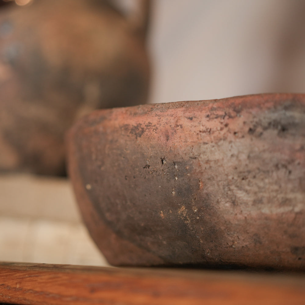 Aged terracotta four-handled cooking bowl