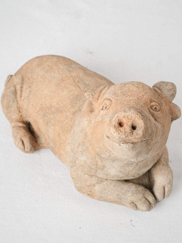 Vintage reconstituted stone garden pig sculpture