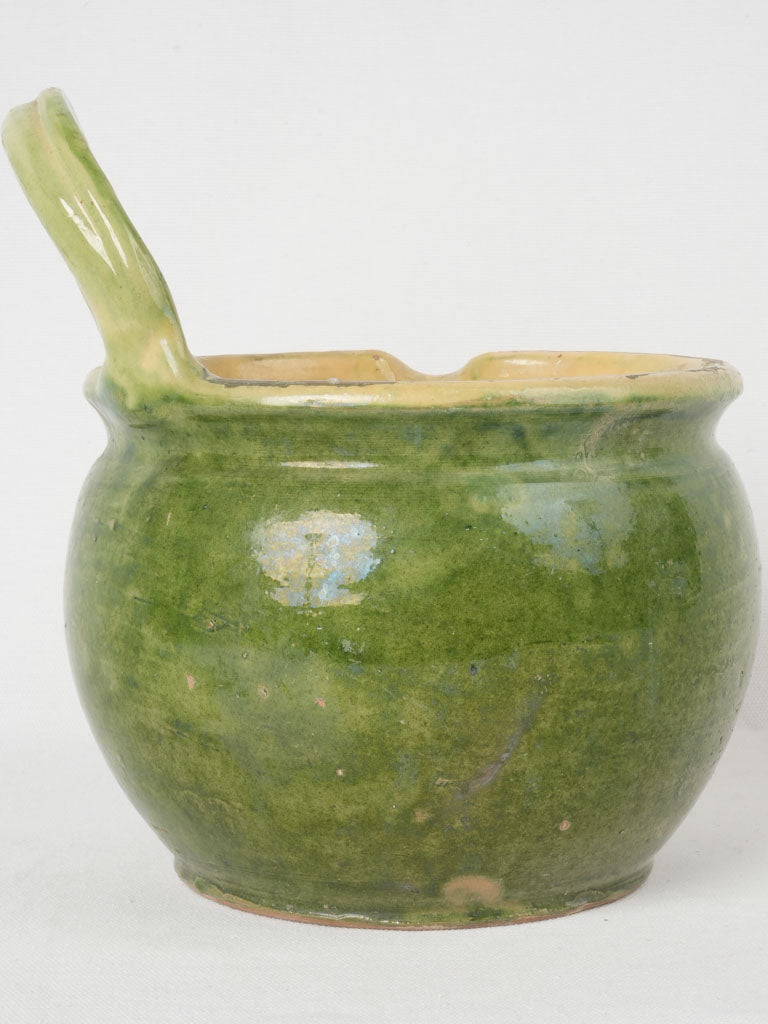 Green glazed antique milking vessel