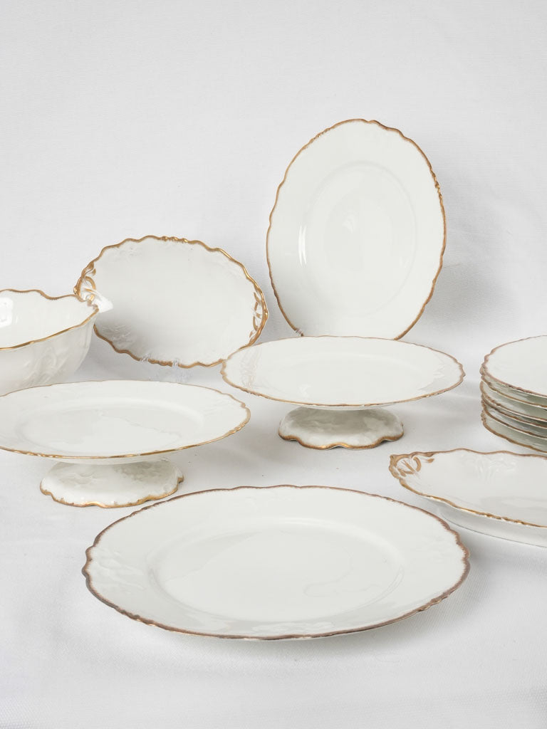 Late 19th century Limoges porcelain dinner service w/ gold border