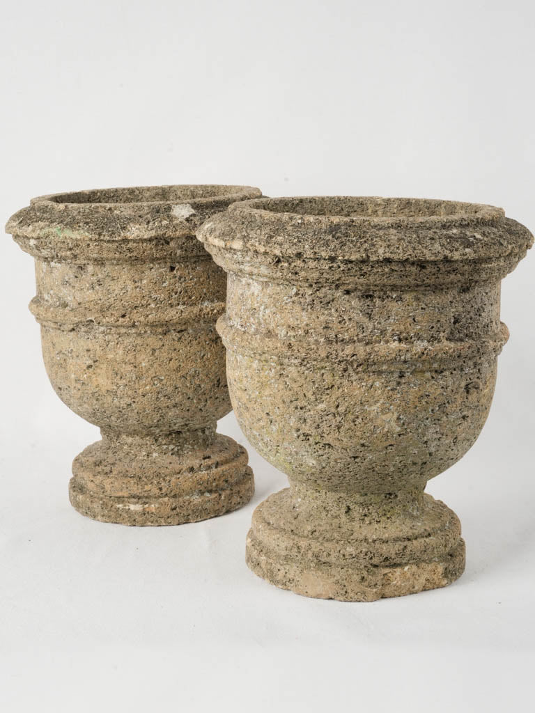 Weathered compact limestone urns