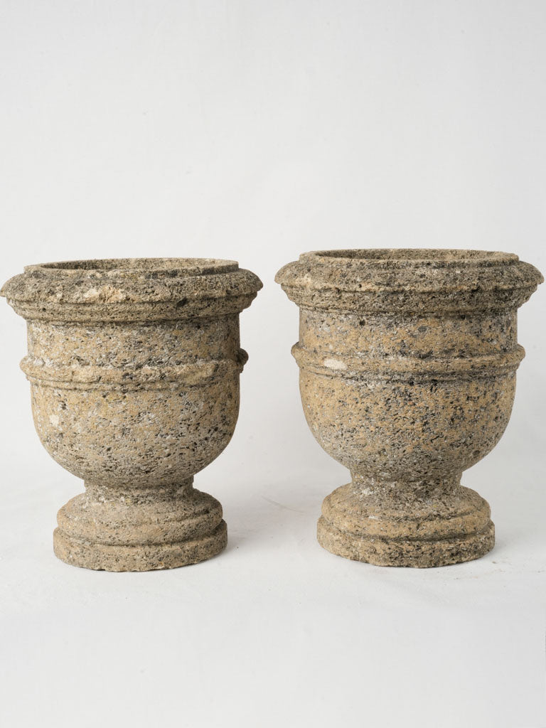 Neutral-toned vintage limestone urns