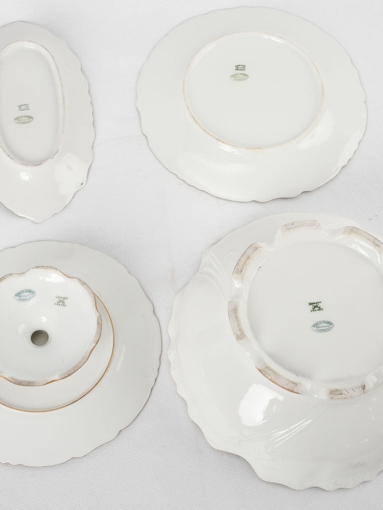 Late 19th century Limoges porcelain dinner service w/ gold border