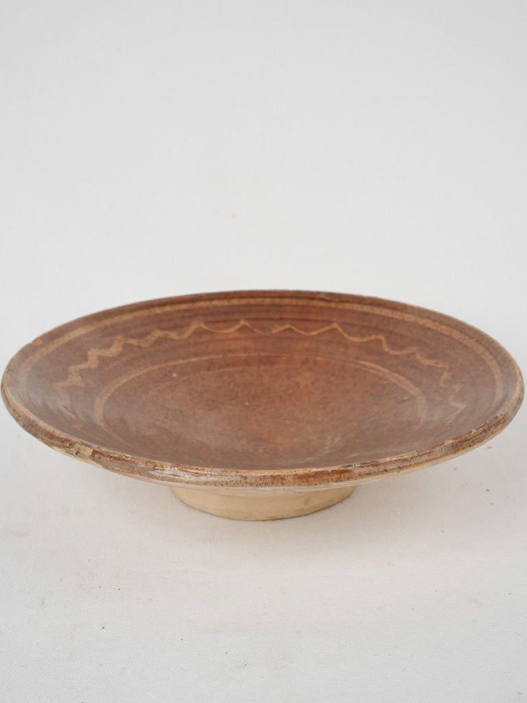 Charming squiggle-decorated terracotta omelet plate