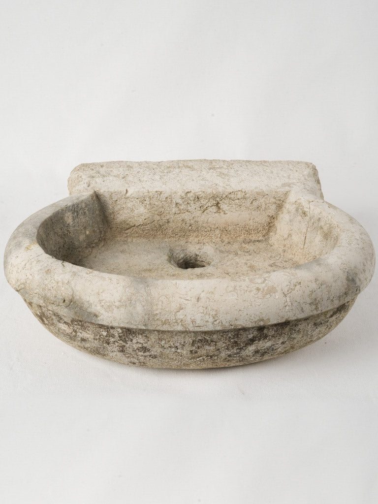 Antique rustic limestone wall basin  