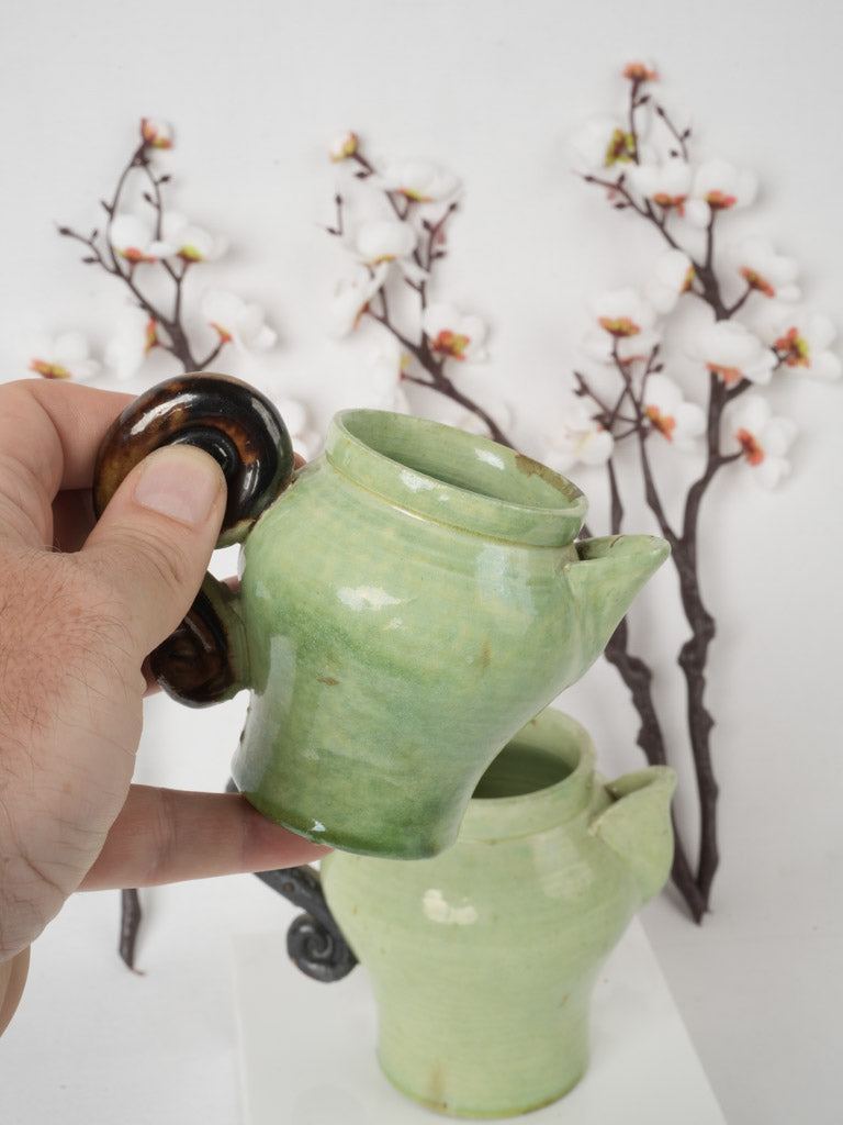 Intricately designed ceramic pea green creamers