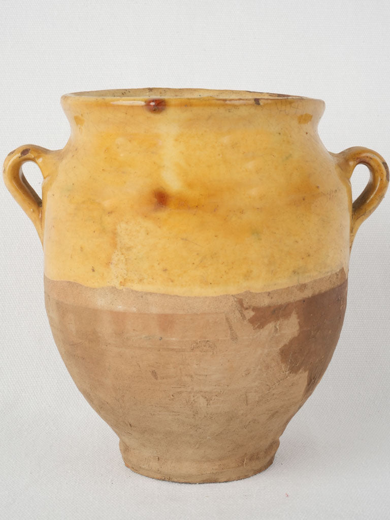 Vintage, handcrafted, rustic terracotta confit pot