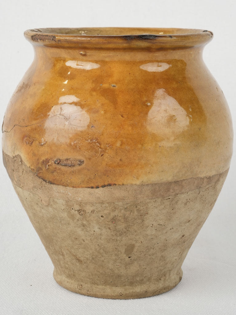 Aged yellow ocher glazed ceramic pot