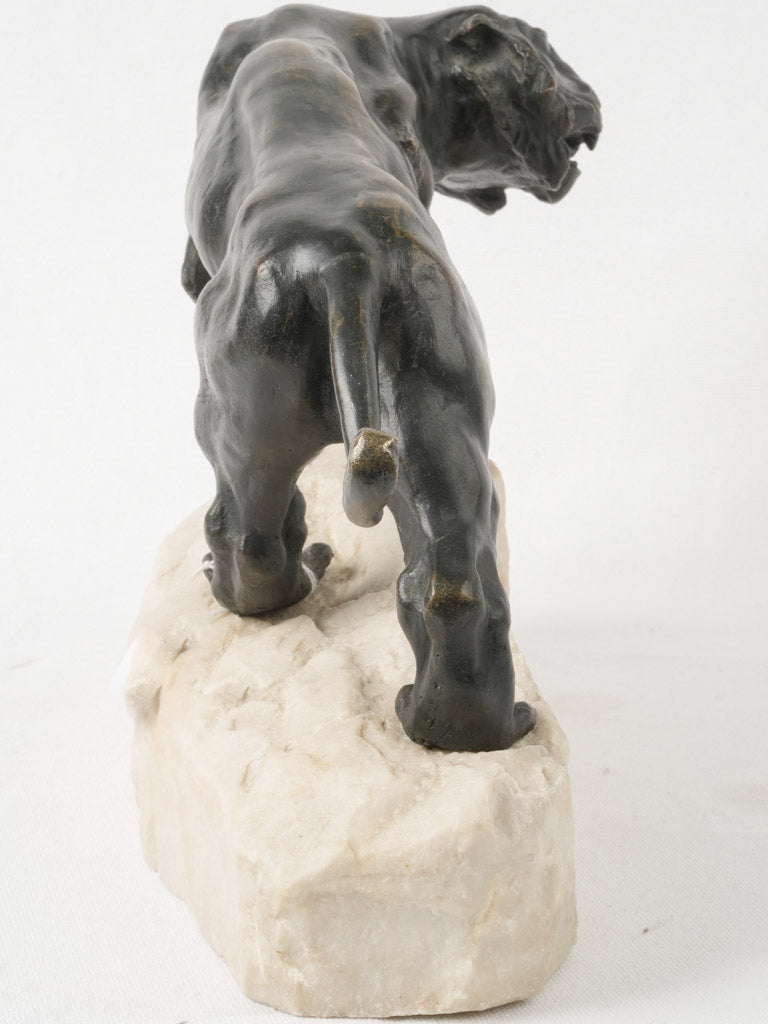 Dramatic tiger on marble base