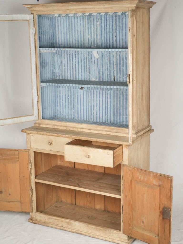 Elegant glass-paneled display cupboard