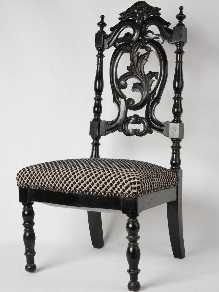 Ornate Napoleon III sculpted black chair