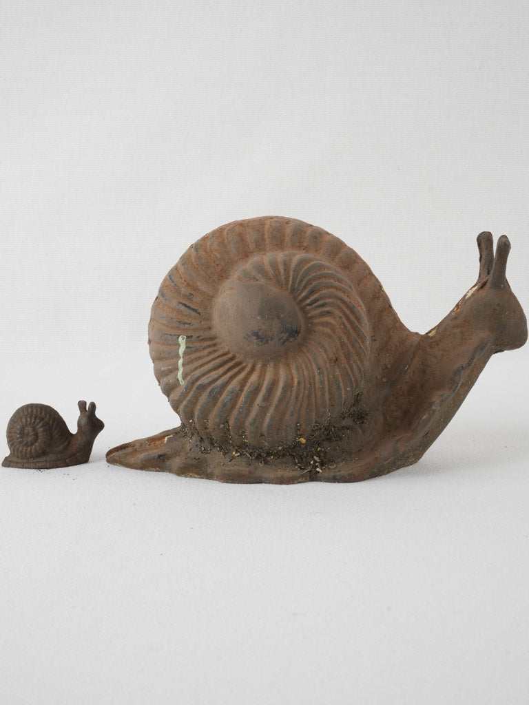 Quaint patio iron snail statues